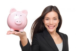 Businesswoman holding piggy bank - savings concept. Business wom